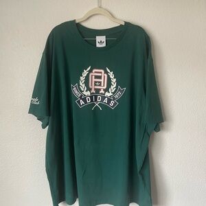 Adidas originals men’s graphic tee in collegiate green with a loose fit